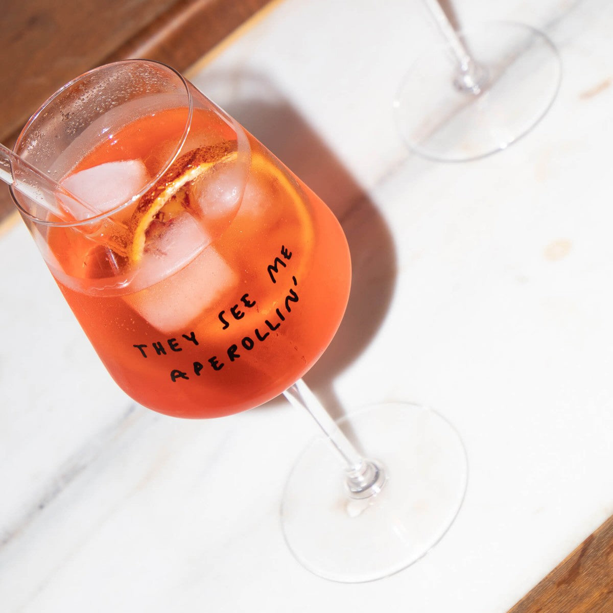 "They See Me Aperolin'" Wine Glass by Johanna Schwarzer × Selekkt