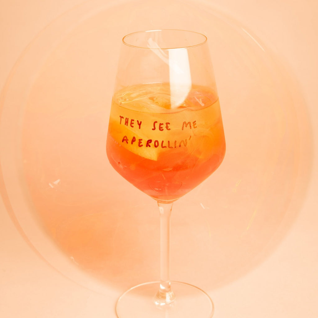"They See Me Aperolin'" Wine Glass by Johanna Schwarzer × Selekkt